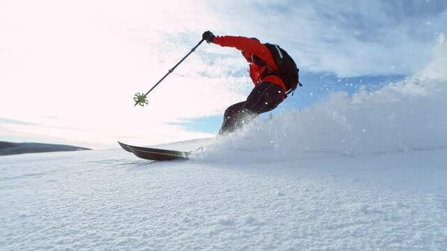 Freeride skier riding in the scenic mountains. Super slow motion at 1000 fps.