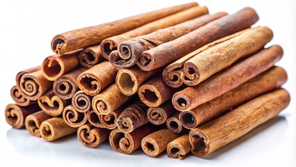 A pile of cinnamon sticks, some stacked and some laying flat, on a white background.