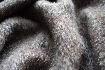 Naklejka premium brown background with soft, warm and cozy blanket texture