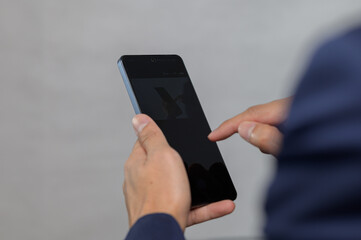 Person Using Smartphone with Focus on Touchscreen Interaction
