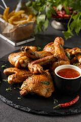 Mix of baked chicken pieces.