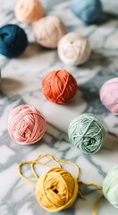 Knitting. Balls of cotton and wool yarn in warm tones on a white table. Boho, bed tones, orange, pink, turquoise, hobby