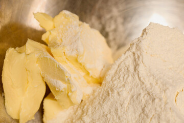 butter and flour in a bowl while preparing a dessert