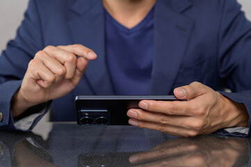 Businessman Using Smartphone for Communication and Online Tasks