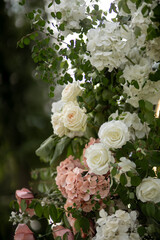 Wedding ceremony. Very beautiful and stylish wedding arch, decorated with various fresh flowers, standing in the garden. Wedding day. Fresh flowers decorations, Peony weddng.