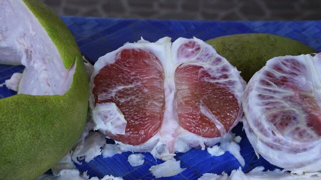 Easy way to peel red pomelo with a knife