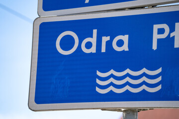 The Oder river sign in Poland. Information name signage plate. Letters in Polish language, Odra...