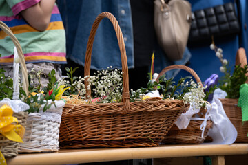 Easter basket for blessing in a church. Traditional woven wicker Paschal basket or Kosz wielkanocny...