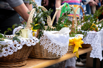 Easter basket for blessing in a church. Traditional woven wicker Paschal basket or Kosz wielkanocny...