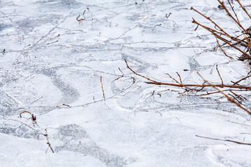 Abstract natural ice texture. Freezy ice surface. Blue backdrop with cracks and scratches on frozen water. Banner.