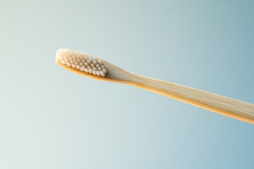Fototapeta premium A sustainable bamboo toothbrush with soft bristles, promoting oral hygiene and eco-consciousness.