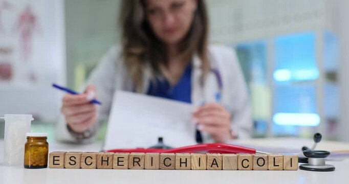 A healthcare professional meticulously analyzes data related to the bacterium Escherichia Coli in a laboratory setting