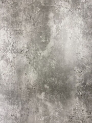 Close-up of a gray concrete texture with natural patterns, rough surface, and subtle variations in tone