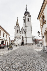 Obraz premium Medieval Town Pisek and historic old street with church of the nativity of the blessed Virgin Mary.