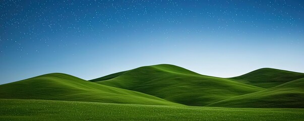 Obraz premium Starry skies nature concept. Serene green hills under a clear blue sky, perfect for nature enthusiasts and relaxation.