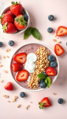 Bowl of granola with yogurt and berries for healthy breakfast.