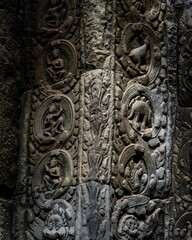 Intricate stone carvings on ancient temple walls.