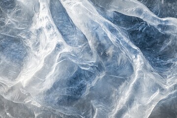 Obraz premium Abstract image of glacial ice, showcasing its textured, translucent, and flowing formations in shades of blue and white.