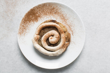 Overhead view of vanilla frosting coated cookies, top view of vanilla cookies with a vanilla cream frosting, process of making bakery style cookies