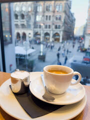 Cup of coffee and milk with views to Marienplatz in Munich, Germany. European tourism, gastronomy concepts