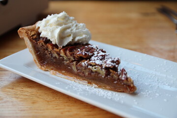 Slice of pecan pie on a plate at a restaurant in downtown Columbus, Ohio.