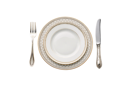 Porcelain dinnerware with interwoven gold patterns on the rim, paired with intricately designed silver-handled cutlery for a regal dining experience, isolated on a transparent background