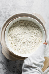 overhead view of All purpose flour in a bowl, baking flour in a bowl