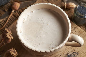 Vegan poppy seed milk in a ceramic cup