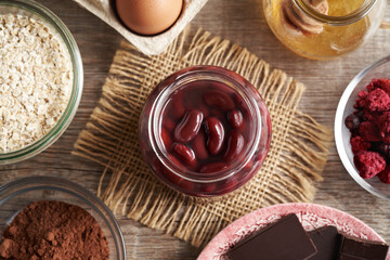 Ingredients for baking gluten-free brownies - red kidney beans, oat flakes, eggs, cocoa and honey