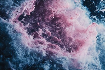 Fototapeta premium Abstract cosmic nebula with swirling pink and blue hues, resembling a vibrant galaxy.