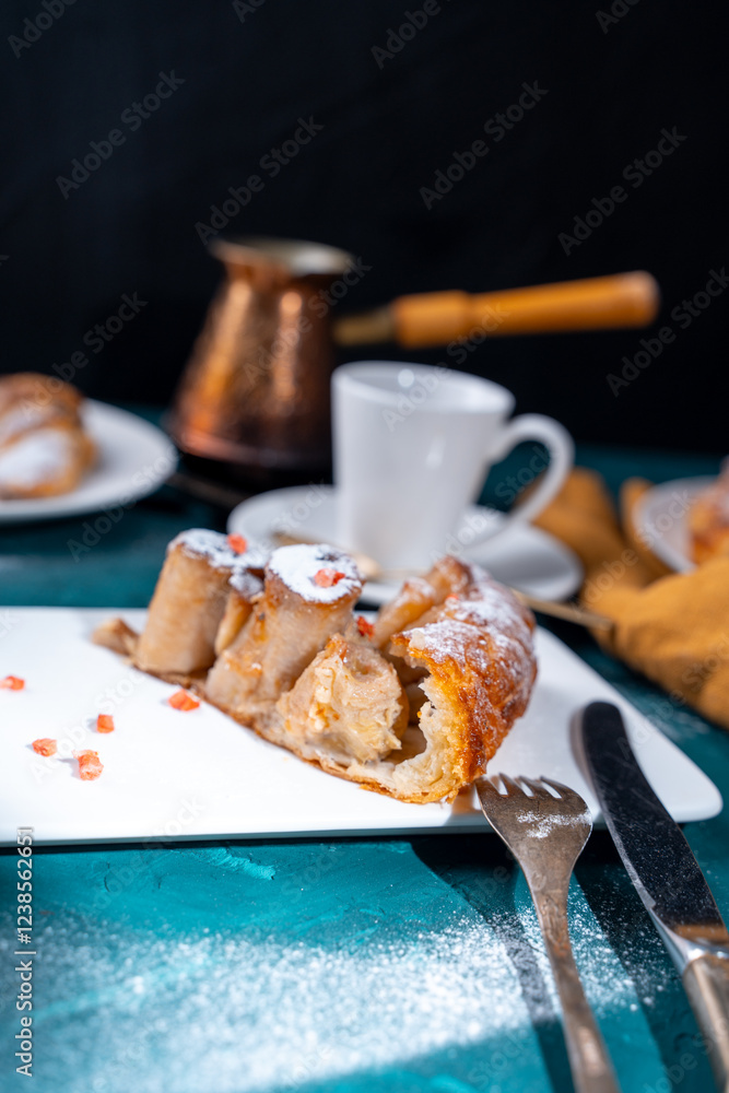 Sticker Banana dessert Tarte tatin and croissants on a dark green background with a cup of coffee brewed in a cezve and freeze-dried raspberries.