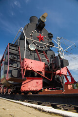 Wheels of an old locomotive. Vertical photo.