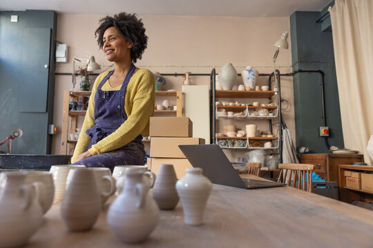 Craft Business Owner in her workspace planning her business growth