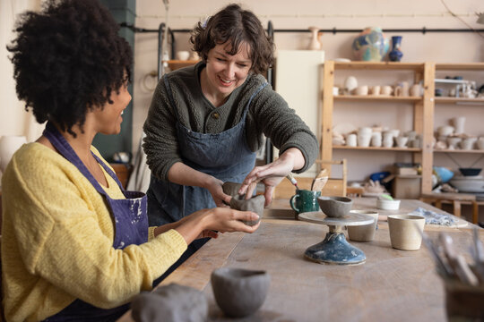 Friendly Artist teaching a Pottery class