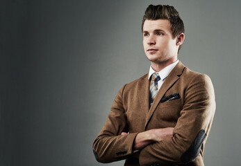Fashion, businessman and arms crossed in studio for thinking, broker and pride for formal clothes. Mockup, banker or confidence with ideas for financial investment, corporate style or gray background