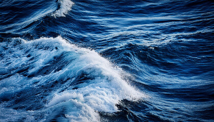 Obraz premium dark blue ocean waves with white foam patterns