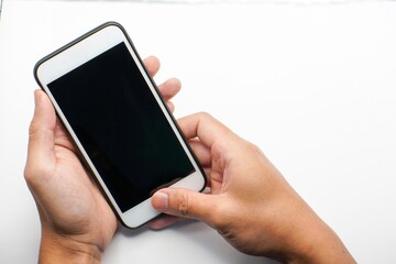 Hand holding Smartphone photo and isolated on white background for your mobile phone app or web site design, logo Global Business technology
