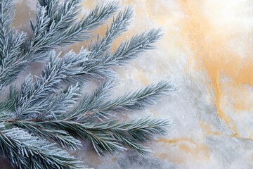 Frost-covered pine branches on a light beige marble background, winter scene.