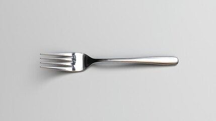 Silver fork on grey background, food cutlery