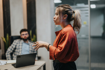 Diverse group of business colleagues engaged in a meeting, brainstorming ideas and strategies in a modern office setting. The image captures the essence of teamwork and collaboration in a meeting room
