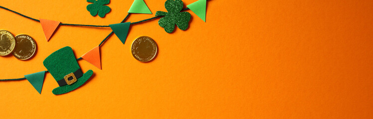St. Patrick's Day decorations with green shamrocks, a leprechaun hat, gold coins, and colorful...