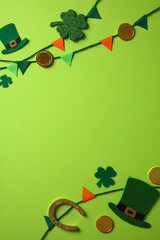 St. Patrick's Day background with green hats, shamrocks, gold coins, a horseshoe, and colorful...