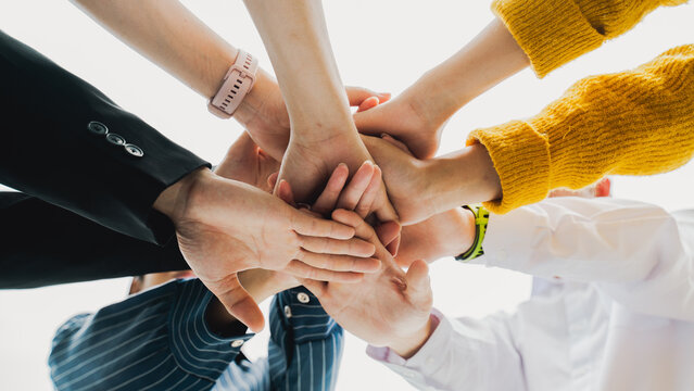 Panoramic teamwork business join hand together,Teamwork power,unity concept.group of friends put their hands together.Volunteer charity work.People joining for cooperation success business.