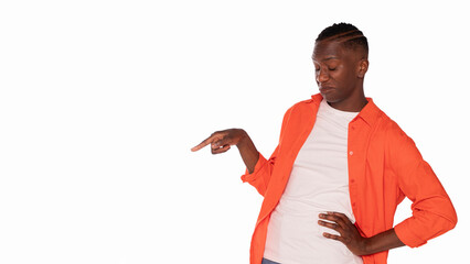 Confident person showcasing style with playful gesture in vibrant orange shirt