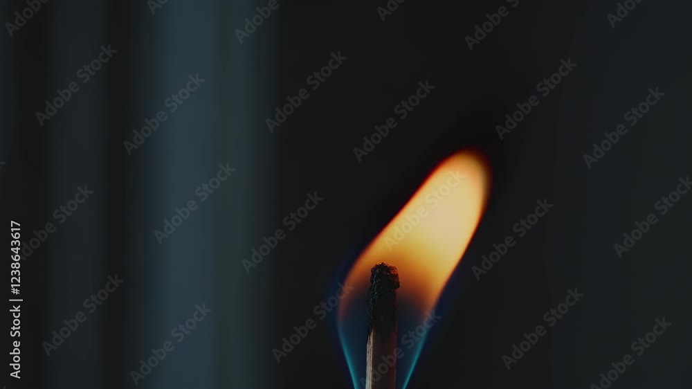 Aufkleber capturing the art of flame as a match ignites in a darkened space