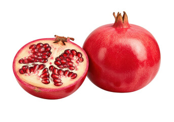A whole pomegranate with a vibrant red hue, alongside a halved pomegranate and scattered ruby-red seeds, isolated on a white background