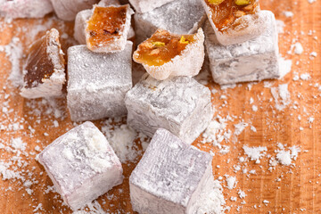 Sweet food Turkish delight, assorted rahat locum in form of cubes with nuts and powdered sugar, traditional food