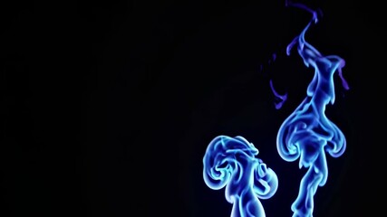 Two vibrant blue ink drops are dissolving in water, creating mesmerizing abstract shapes against a black background, resembling otherworldly creatures or smoke plumes - Powered by Adobe