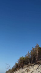 Obraz premium Sandy Cliff Against Clear Blue Sky