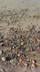 Colorful Pebbles Under Clear Water